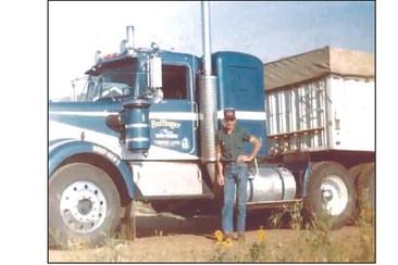 Gene Bollinger poses with one of his trucks during the 1970s. Bollinger Trucking is celebrating 70 years of service this weekend.