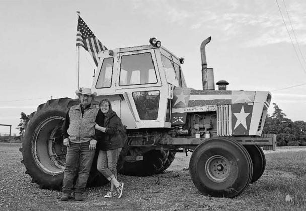 Oren and Tracy Lesmeister are displaying their Spirit of ‘76 tractor at their place on Highway 212.