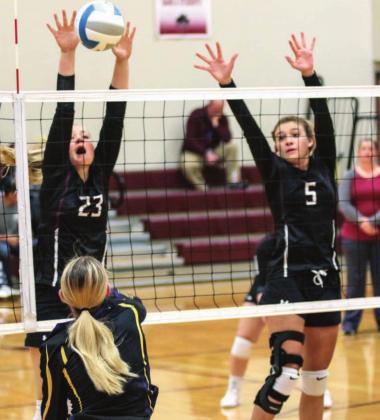 Panthers Stormi Hulm (23) and Shay Kraft (5) leap to defend the net against Herreid/Selby Area in recent volleyball action. Photos by Jon Flatland