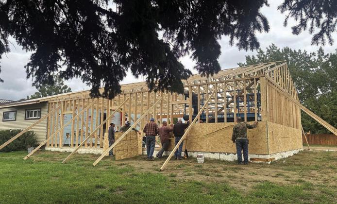 Volunteers have been busy - when it isn’t raining - building an attached garage at the Holy Cross Church rectory.