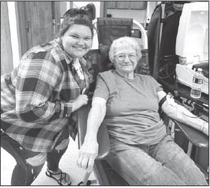 Frequent donor Kathleen Meier was one of the volunteers who donated blood at the blood drive conducted by Valiant at Timber Lake on Monday, August 31. Her donation put her at the one gallon mark. Mersedes Rough Surface (left), the local coordinator, reported, “We started the blood drive hoping for 14 units of blood and ended with 25. It was a great successful drive, and I’m really looking forward to the next one.” Photo by Kathy Nelson