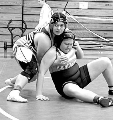 McLaughlin-Timber Lake’s Lilly Veit (left) looks for direction from the Mustang coaching staff while locked onto Mobridge-Pollock’s Tatum Silbernagel during the Girls 176-185 pound championship at the Potter County JV Tournament in Gettysburg on Monday, Dec. 4.