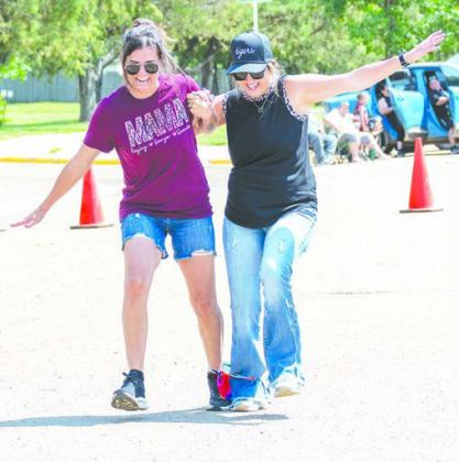 Jazmyn Holmes and Makense Wall in the three legged race
