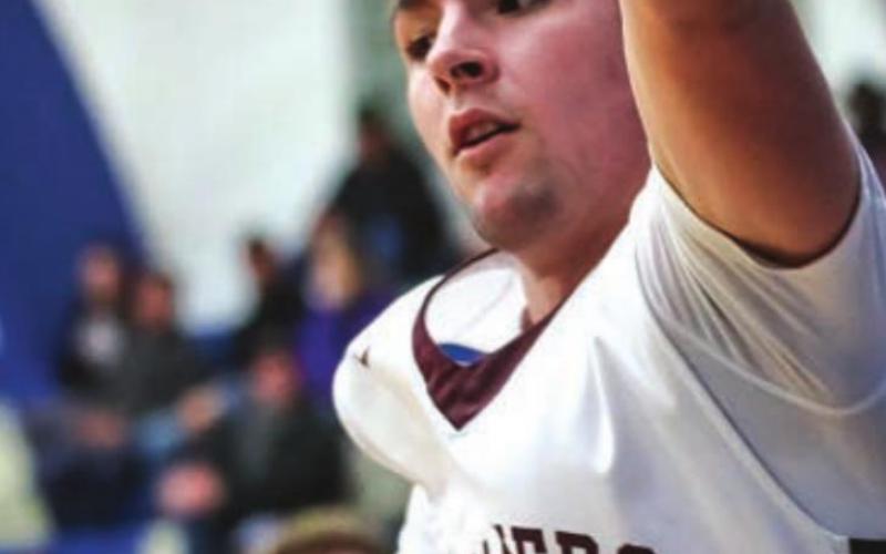 Timber Lake junior Brandt Ducheneaux leaps out of bounds to try and save the ball in LMC tournament action.