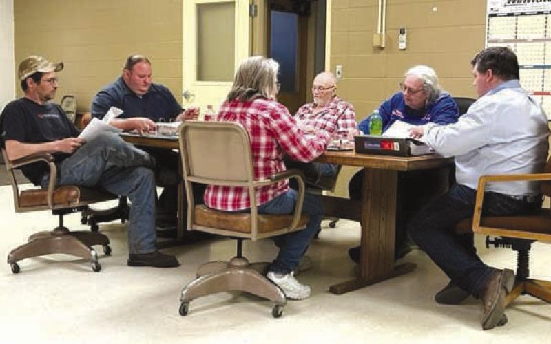 Members of the town of Isabel’s Board of Trustees discuss an estimated $2.1 million wastewater infrastructure improvement project on Monday, May 15. Members include, L-R, Clint Doan, Vice-President Daryl Pfaff, Judy Gifford, Darrel Burke, Finance Officer Karla Nordyke, and President Ryan Maher. Photo by Jon Flatland