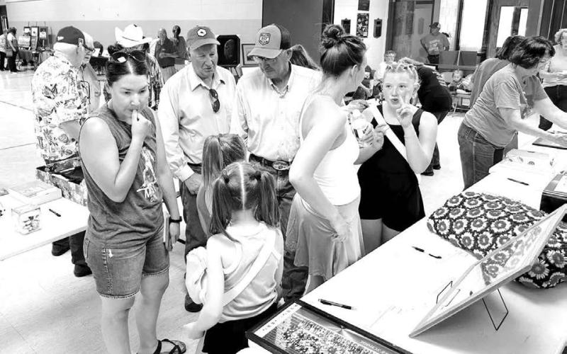 The July 26 silent auction and live auction fundraiser raised over $11,000 for the Historical Society and Museum. Where else could a jar of sea shells bring $100 or a Scherer’s Dairy milk bottle sell for $1300? The Tucker Kraft autographed pictures donated by Dean Hagen (TLHS Class of ‘65) were among the top-selling items. Photos by Kathy Nelson