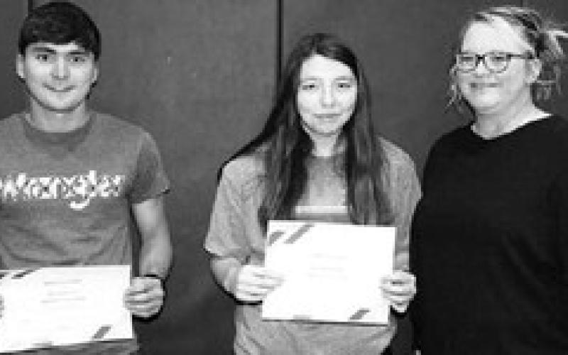 LEFT: Robyn DePoy (RIGHT) presented DHS Alumni Scholarships to (LR): JW Pederson, Nevaeh Farlee.