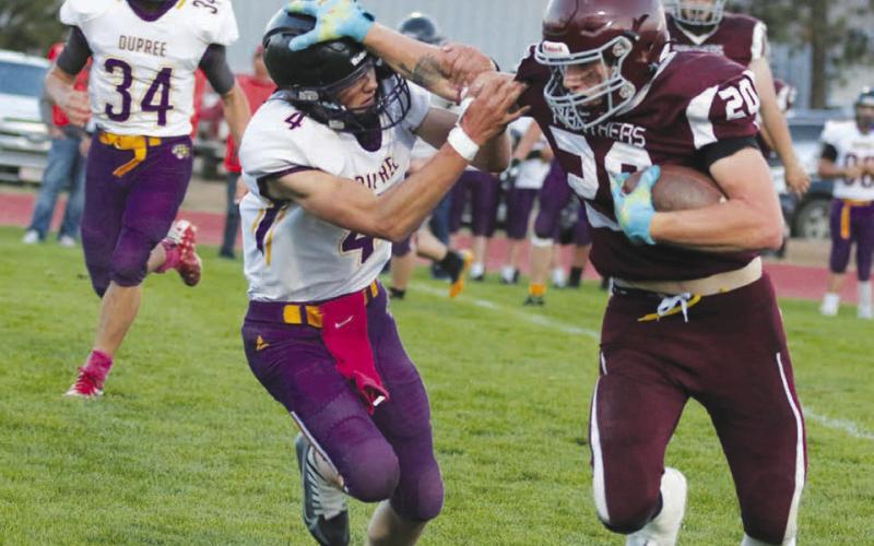 Timber Lake senior tight end Thane Keller stiff-arms Dupree defensive back Treg Thorstenson during the Panthers’ 38-0 homecoming win over the Tigers last Friday, Sept. 9. Keller finished with four receptions for 51 yards and a touchdown. Photo by Jon Flatland