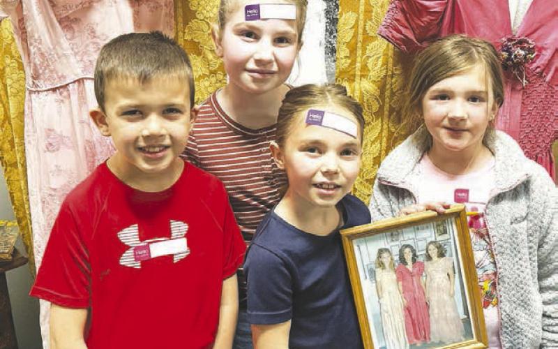 These kids found vintage dresses that belonged to their great-grandma, Mary Long, and a picture of some of their aunts modeling them.