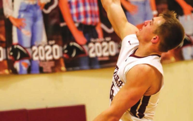 Hank Kraft lays in 2 points for the Panthers. Photo by Robert Slocum