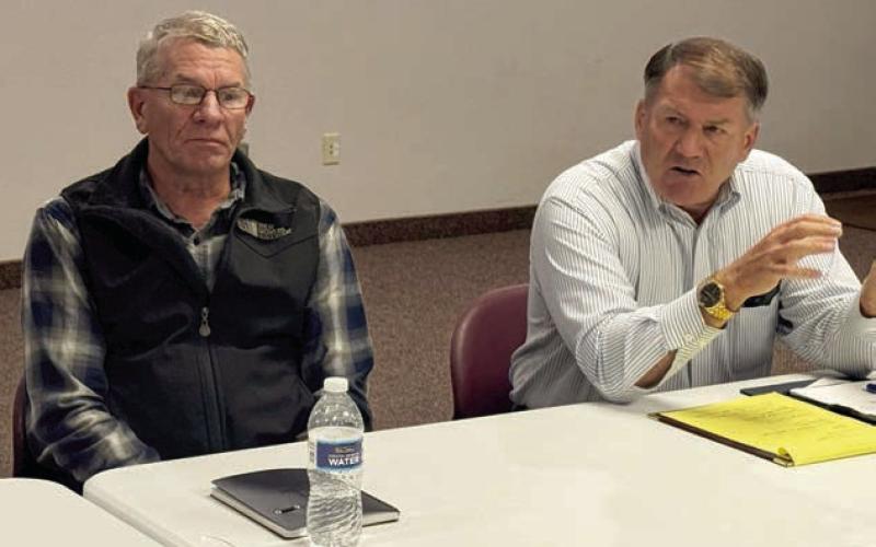 Sen. Mike Rounds (R-SD), right, speaks at a meeting last Monday, Sept. 22, in Pierre. At left is Doug Simons, president of the South Dakota Wheat Growers Association. Photo by Bart Pfankuch