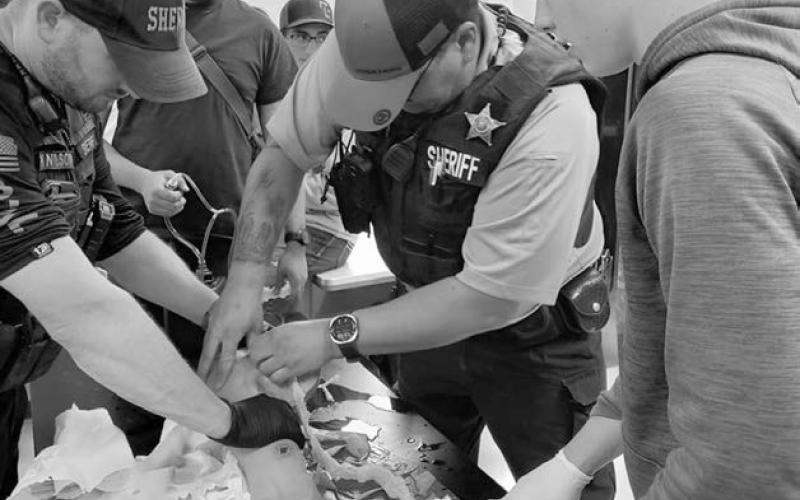 For the second year, South Dakota Emergency Medical Services for Children partnered with local Pediatric Champions and driver’s education instructors to present “Choices, Chances, Decisions (CCD)” and “Stop The Bleed (STB)” curriculum last Thursday, June 5, at the Timber Lake School. Above, Dewey County Deputy Chandler Ross teaches students how to apply a tourniquet during the Stop the Bleed program.