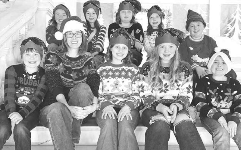 Schaffer Music Studio’s Pop Choir performed on December 6 at the State Capitol. Front (L-R): Clara Nilson, teacher Colette Schaffer, Tegan Baker, Elyse Parker, Milo Linderman; back: Brie Parker, Kiernan Biegler, Miné Baker, Bexley Dupris, Isaac Schweitzer