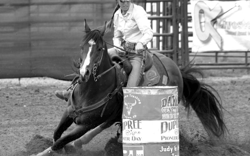 Minda Woodward of Dupree , current South Dakota Rodeo Association (SDRA) season point leader in barrel racing, competes at a recent event in Dupree. Photo by Jon Flatland