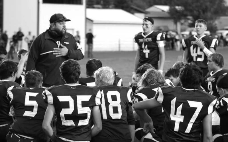 Timber Lake head coach Ryan Gimbel speaks to his players during halftime of a recent game. File photo