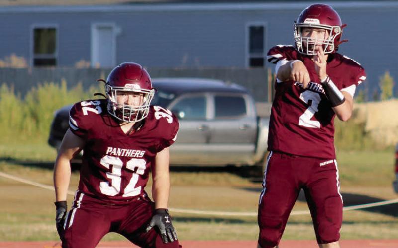 Timber Lake quarterback Cole Ducheneaux (2) fires a pass over the middle while running back Gabe Keller (32) stands guard in pass protection. Ducheneaux threw for two touchdowns and ran for another as the Panthers got past North Central 20-6 last Friday at Kraft Field.