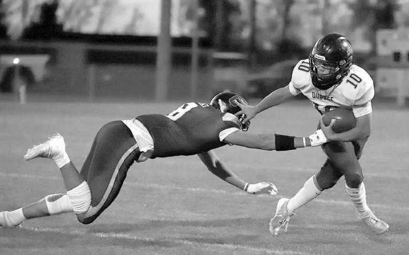 Dupree running back Tre’ White Wolf (10) shakes off a defender’s attempt to tackle him during the Tigers matchup with the Castlewood Warriors last Thursday, Oct. 23, in the first round of the State Class A football playoffs. Castlewood, 8-1, knocked off 6-3 Dupree by a score of 46-12. Photo courtesy of LeeAnne Dufek/Hamlin County Publishing