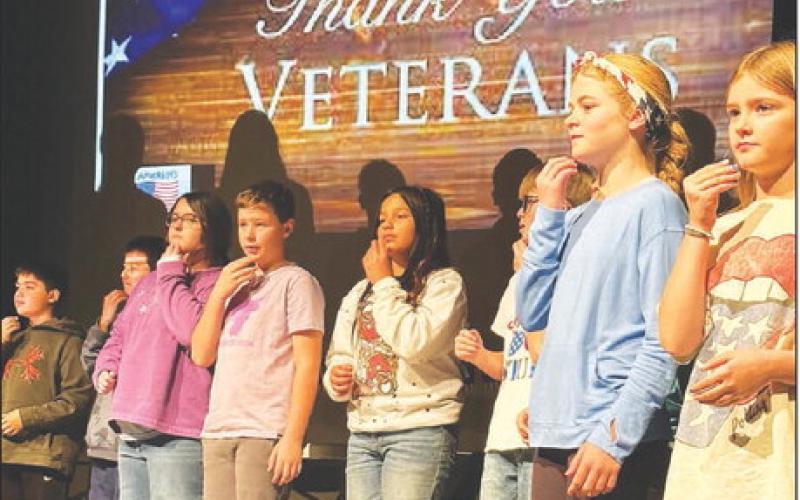 Fifth graders performed “God Bless America” in sign language at the Timber Lake Elementary School Veterans Day program on November 10. L-R are Glen Mowrer, John Bigger, Lilly Goodine, Kyren Ley, Marley Ward, Luke Beer, Alexa Roggow, and Lily Handeland. Each third, fourth and fifth grade class performed. Photo by Kathy Nelson
