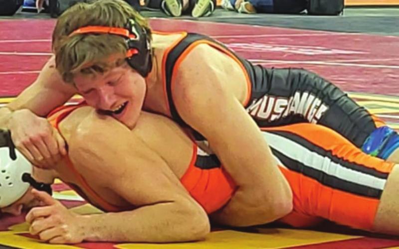 Timber Lake junior Thane Keller rides an opponent during a match at the South Dakota High School Class B Wresting Championships in Sioux Falls last weekend. Wrestling at 160-pounds, he is the first-ever Timber Lake HS student-athlete and just the third team member in Mustang wrestling program history to compete at the state tournament. Keller finished the tournament 1-2 and ended his season at 16-6 overall. Photo by Kyle Henderson