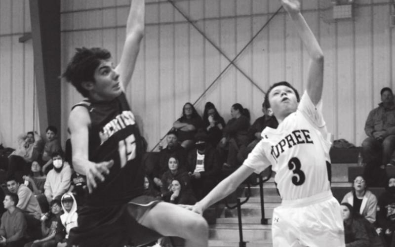 Klayte McLellan, in the ninth grade, had McIntosh’s Ashton Walker on his tail as he was making points for Dupree’s JV team as they beat the McIntosh Tigers 51 to 15. Photo by Patty Peacock