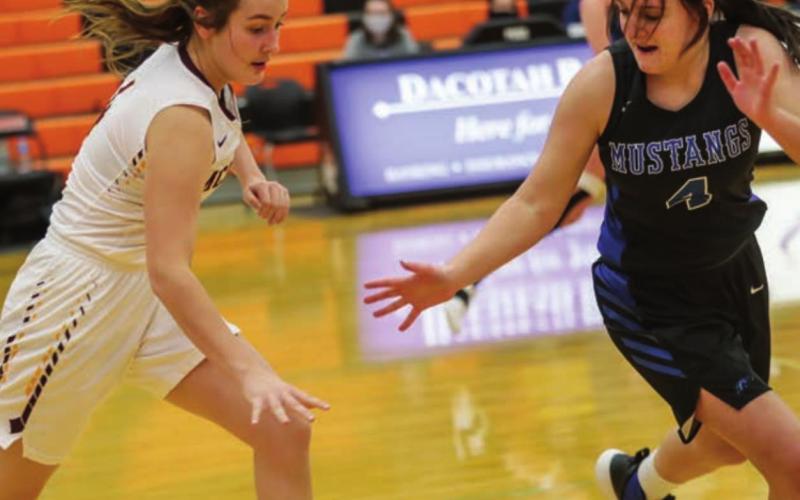McIntosh guard Carlie Lafferty presses the ball up the court against South Border.