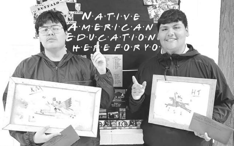 Kingstyn Mutchler (left) and Hayden Thompson with their ledger art.