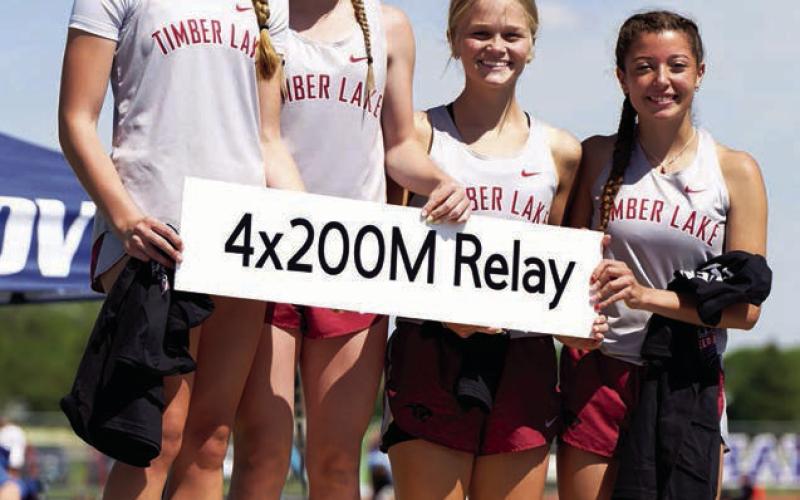 Setting new school records and qualifying for the State Class B Track Meet this week in Brookings is the Timber Lake girls 800 meter relay squad consisting of Josie Boldt, Korbi Heck, Hailey Roggow and Arianna Bieber. The group set a new school mark with a time of 1:50.04 this season. Photo by Marie DuPreez