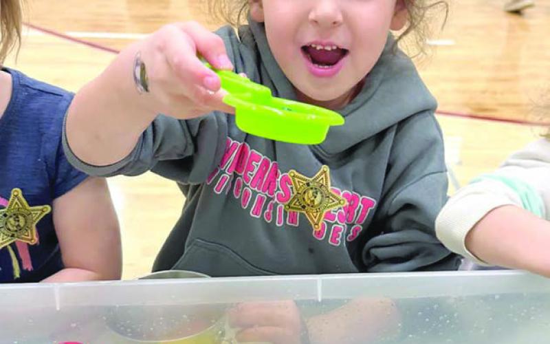 Addy Curley had some fun fishing in the duck pond at the Timber Lake Elementary School’s Family Fun Night last Wednesday, March 19. More than 75 percent of the school district’s elementary school students attended the event. Photo by Kathy Nelson