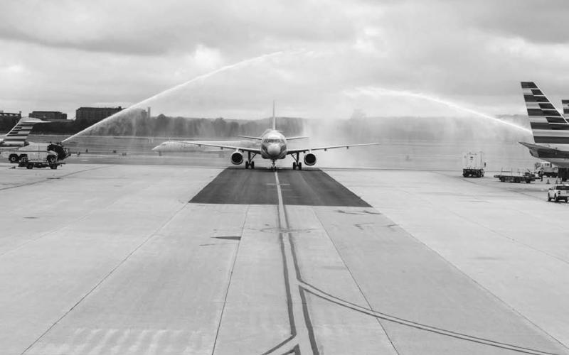 The charter plane carrying the veterans was honored with a salute by fire trucks upon landing in Washington.