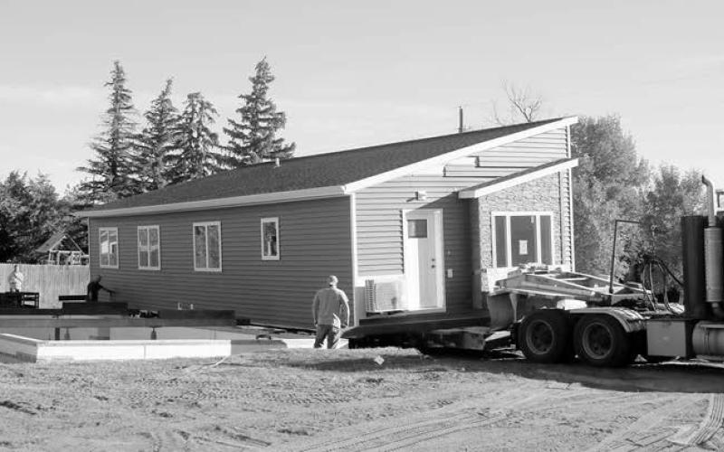 The DakotaPlex Apartments were moved into place at the corner of Sixth and F in Timber Lake. Each component has three bedrooms and garage parking will be constructed between them. The project was spearheaded by Timber Lake and Area Development. The units are being advertised for rent elsewhere in this issue of the Timber Lake Topic. Photos by Jon Flatland