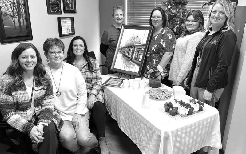 Kris Lawien was the guest of honor at an open house celebrating her retirement at West Dakota Health Center in Timber Lake on December 5. Staff from WDHC and Mobridge Regional Hospital were on hand to observe the special day. L-R are Nicole Schneider, Kris, Candida Goehring, Carol Geditz, Holly Keller, Mersedes Rough Surface, and Jodi Madison.