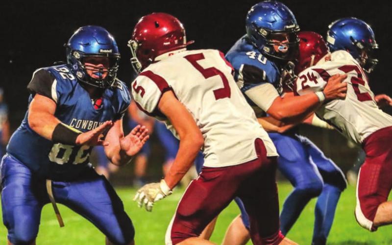 Lemmon/McIntosh linemen Riley Lafferty (82) and Carson Bailey (40) block against Timber Lake’s Trenton Hansen (5) and Konor Lindskov (24) during their 9-man football contest Friday in Lemmon. Photo by Robert Slocum
