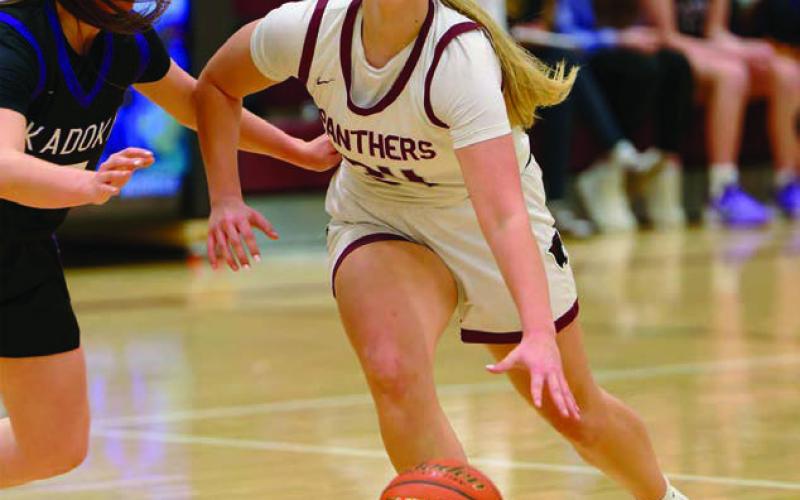Timber Lake’s Madalyn Hermes dribbles past a Kadoka Area defender to penetrate the lane, but most of her work was on the perimeter, where she drained three 3-pointers in a 49-34 loss to the Kougars. Topic Photo/Marie DuPreez