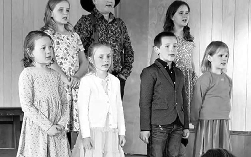Students performing at CC end of year celebration at Isabel. Front (l-r): Olive Anderson, Kimber Clark, Jackson Hunt, Hannah Hunt; Back: Rebecca Hunt, Caleb Simon, and Elizabeth Hunt.