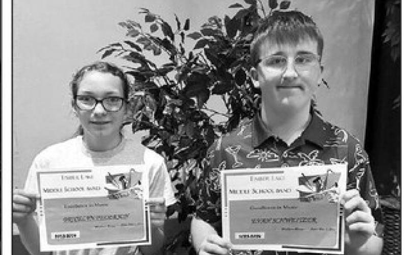 L-R: Bricelyn Pederson and Evan Schweitzer received the Middle School Band Excellence Awards presented by music teacher Walker Rose.