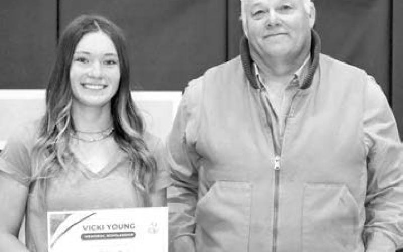 Doug Young presented the Vicki Young Memorial Scholarship to JC Pederson.