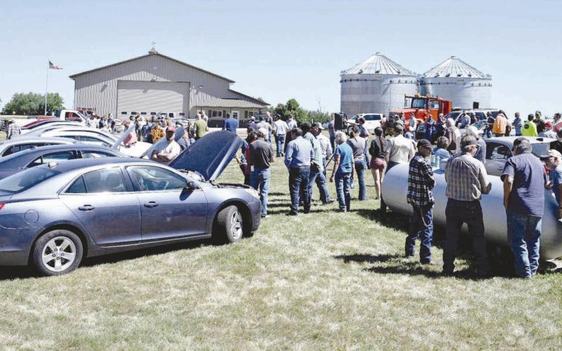 Bidders and lookers gathered at Isabel for the sale of Northwest Area Schools property on June 30. Photo by Marie DuPreez