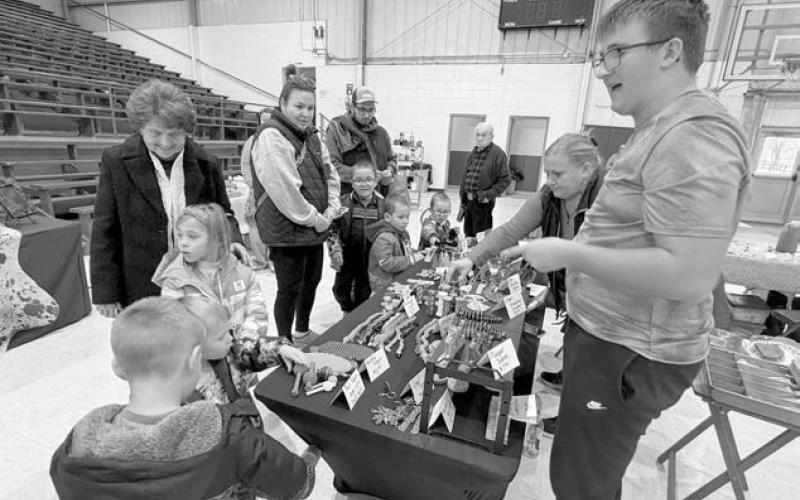 Evan Schweitzer was among the vendors at Isabel’s Holiday Craft Show on Sunday. His spinners and other toys were a huge hit with the kids. Topic photo/Teri Gayer