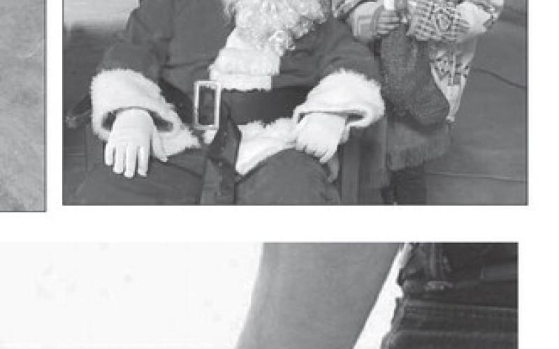 Kids have pictures, hot chocolate with Santa at Isabel