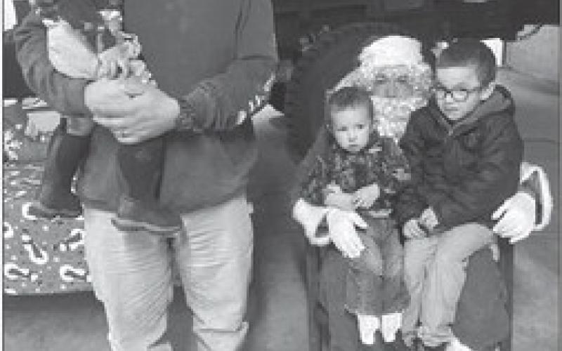 Kids have pictures, hot chocolate with Santa at Isabel