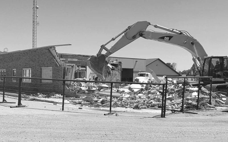 The office building that had served as Moreau-Grand Electric Co-op headquarters since 1959 is being demolished by Miller Construction of Isabel. The space will be used for parking and loading. Offices have been moved to the new headquarters building on the same block, facing Main Street. Photo by Kathy Nelson