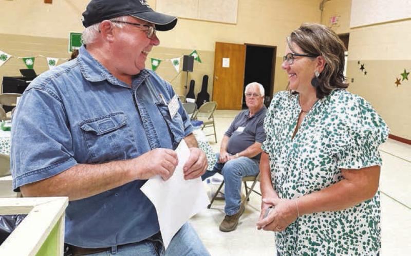 Dewey County 4-H Advisor Rita Long (right) and Roger Lawien, one of the project judges.