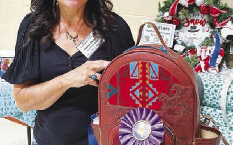 Colette Enright won the Best of Show ribbon in the open class for her leather work.