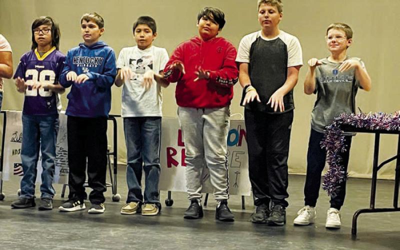 The fifth graders performed “God Bless America” in sign language.