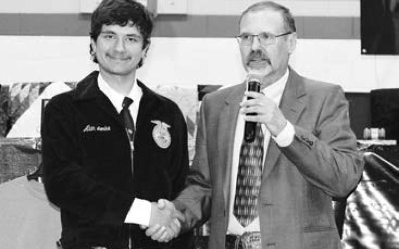 Alan Lemke (LEFT) receiving the Dekalb Senior Ag Accomplishment Award from Advisor Doug Hofer.
