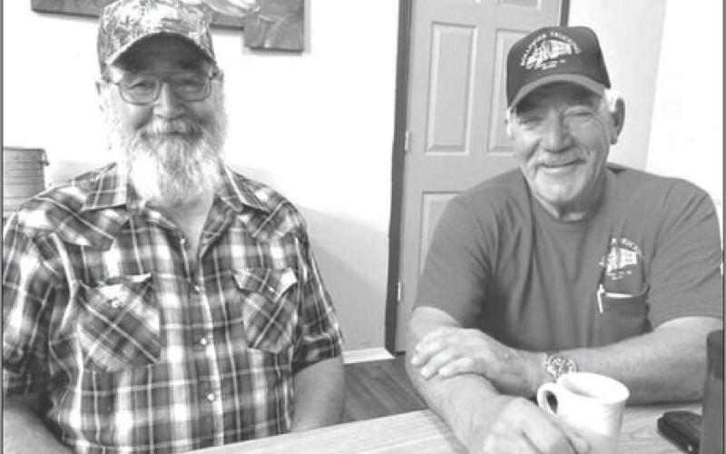 Wade and Tim Bollinger are inviting the public to an open house this Saturday at the Bollinger Trucking shop to celebrate 70 years of service . Over the years, Bollinger trucks have delivered loads to 48 of the 50 states in the U.S. Photo by Jon Flatland