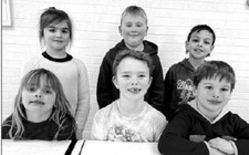 1st and 2nd grade FRONT (L-R): First graders Harper Biegler and Brace Beer (winners) and Baylor Lei (alternate). NOT PICTURED: Cassidy Winterberg (alternate). BACK: Second graders Tabitha O’Bryan and Isaac Schweitzer (winners) and Jayden Traversie (alternate). NOT PICTURED: Charlie Boysen (alternate).