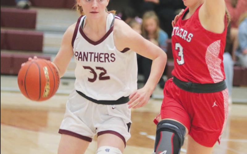 Sophomore guard Jordan Jones (32) is pressured by Potter County’s Rylee Kaup (3) while bringing the ball up court during Timber Lake’s 60-56 win over the previously-unbeaten Battlers last Friday, Jan 6. Photo by Jon Flatland