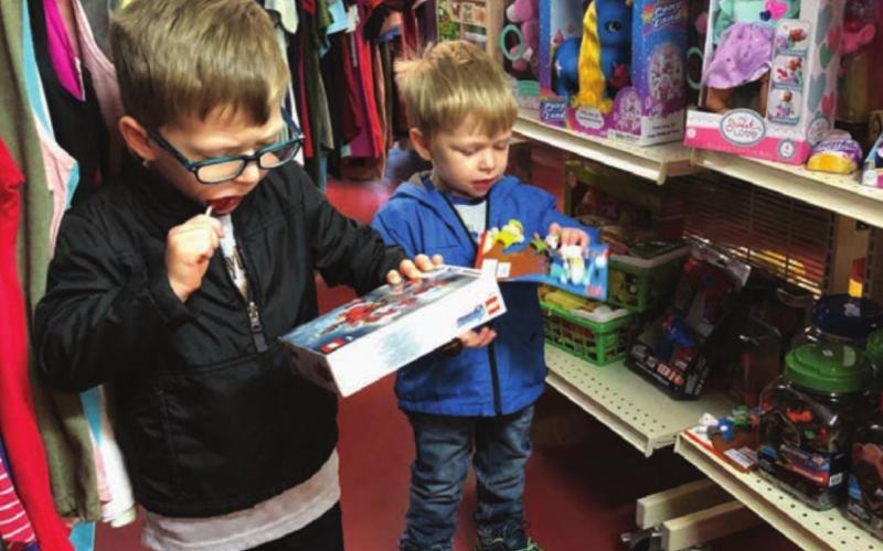 Lincoln and Trevor Aberle and their mom, Melissa, were at Dakota Silk Screen on Monday scouting out the Christmas merchandise. The boys were giving Mom some hints about what to put on their wish lists. They also visited the museum, where they saw lots of dinosaur bones and the T-Rex skull that their great-grandpa Bill Alley discovered.
