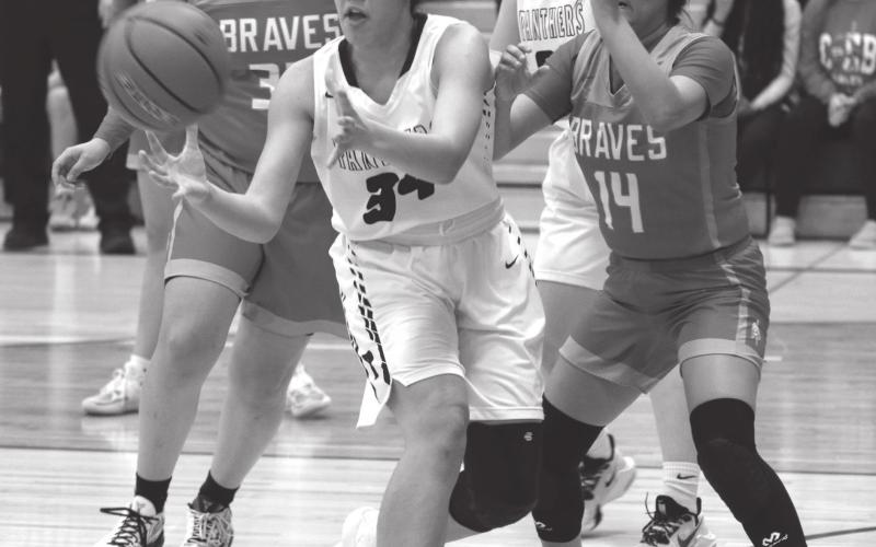 Timber Lake’s Jasmine Nash catches a post entry pass during recent basketball action versus Cheyenne-Eagle Butte. Photo by Jon Flatland